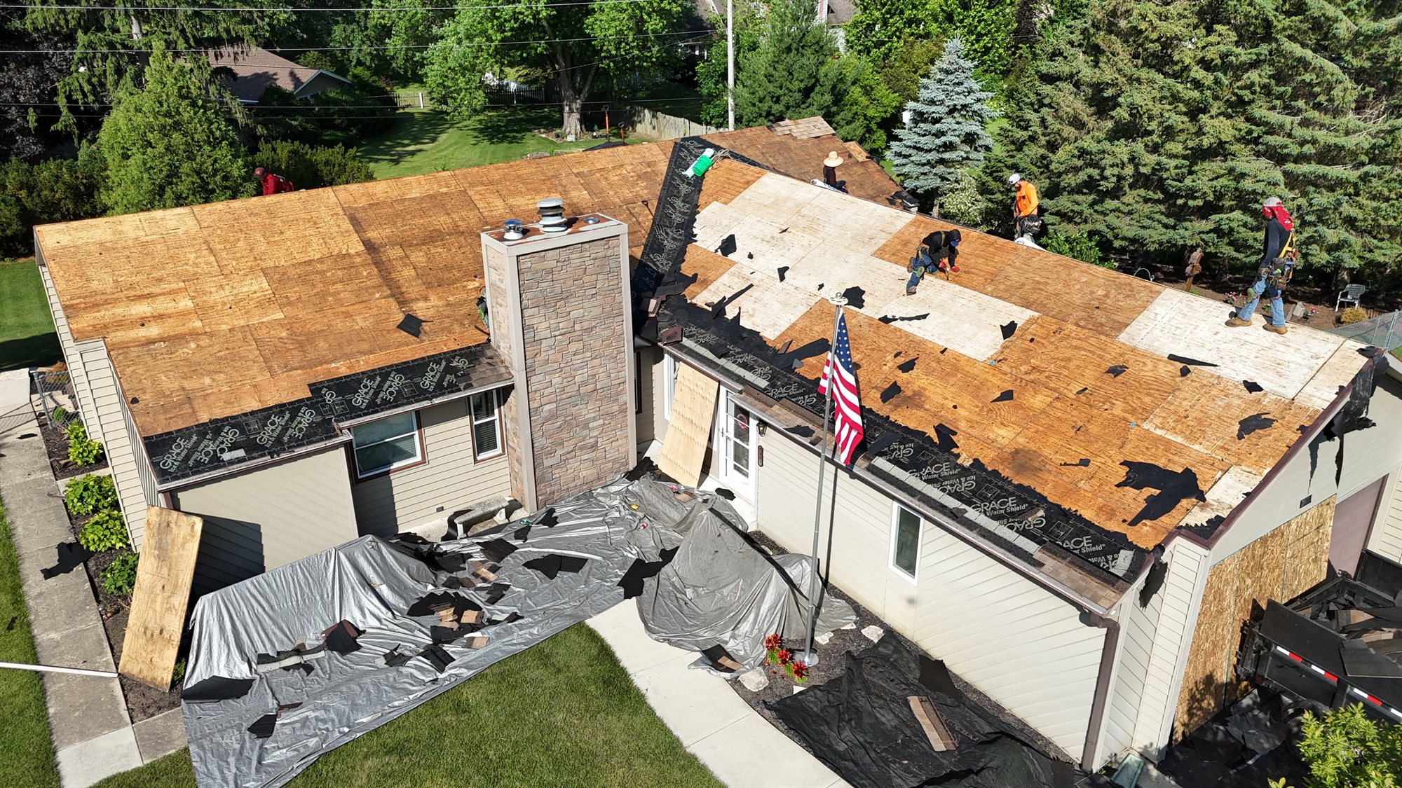 Our Process 1 RX crew installing underlayment on a steep roof in the Chicago suburbs