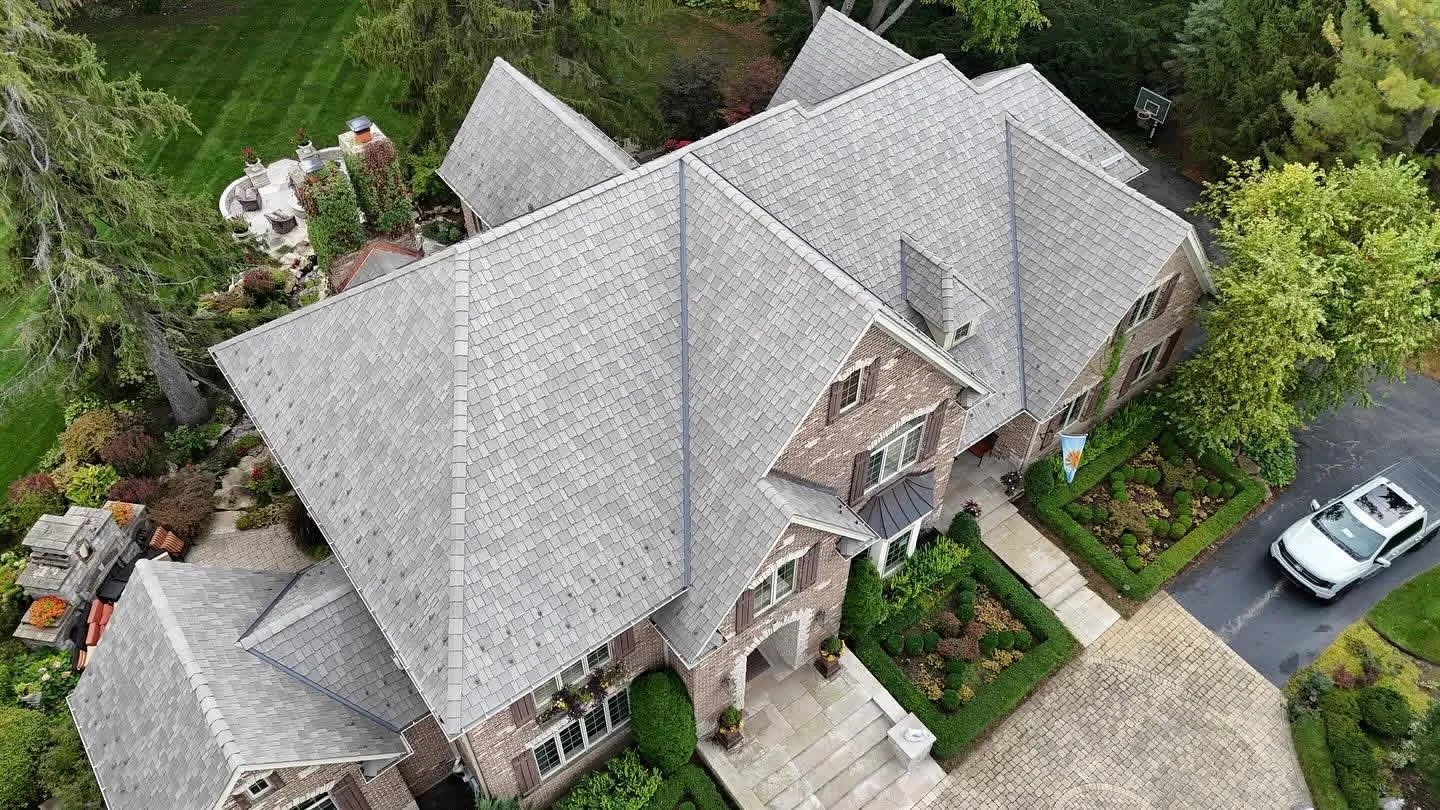 Designer shingle roof replacement showing the hips and valleys on a brick home