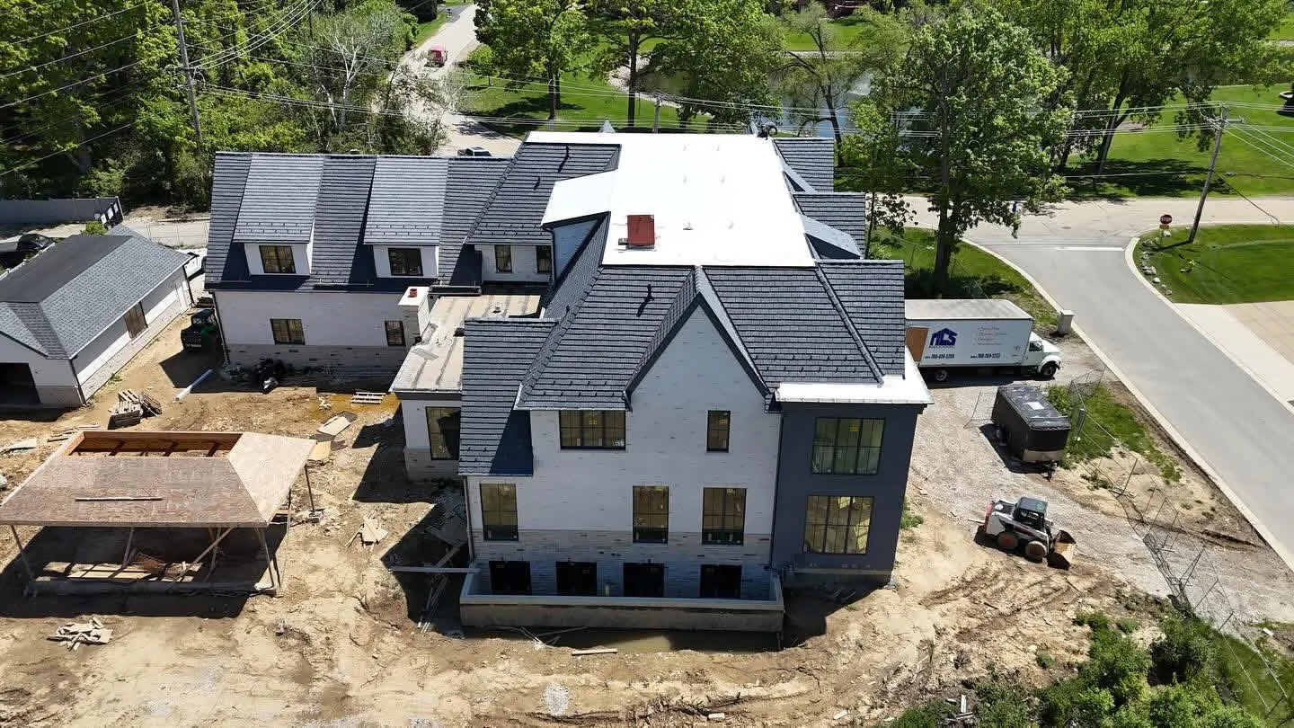 Slate look roof with dormers on a new construction home in the Chicago suburbs
