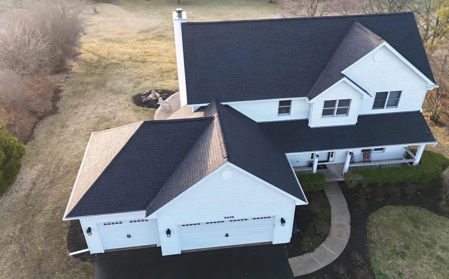New black architectural shingles going on during a roof replacement