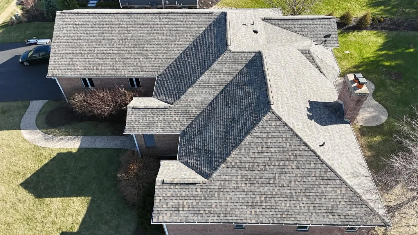 roof replacement weathered wood shingles brick home